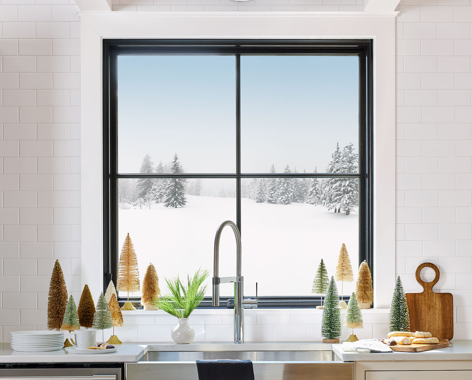 Black awning window over kitchen sink in winter
