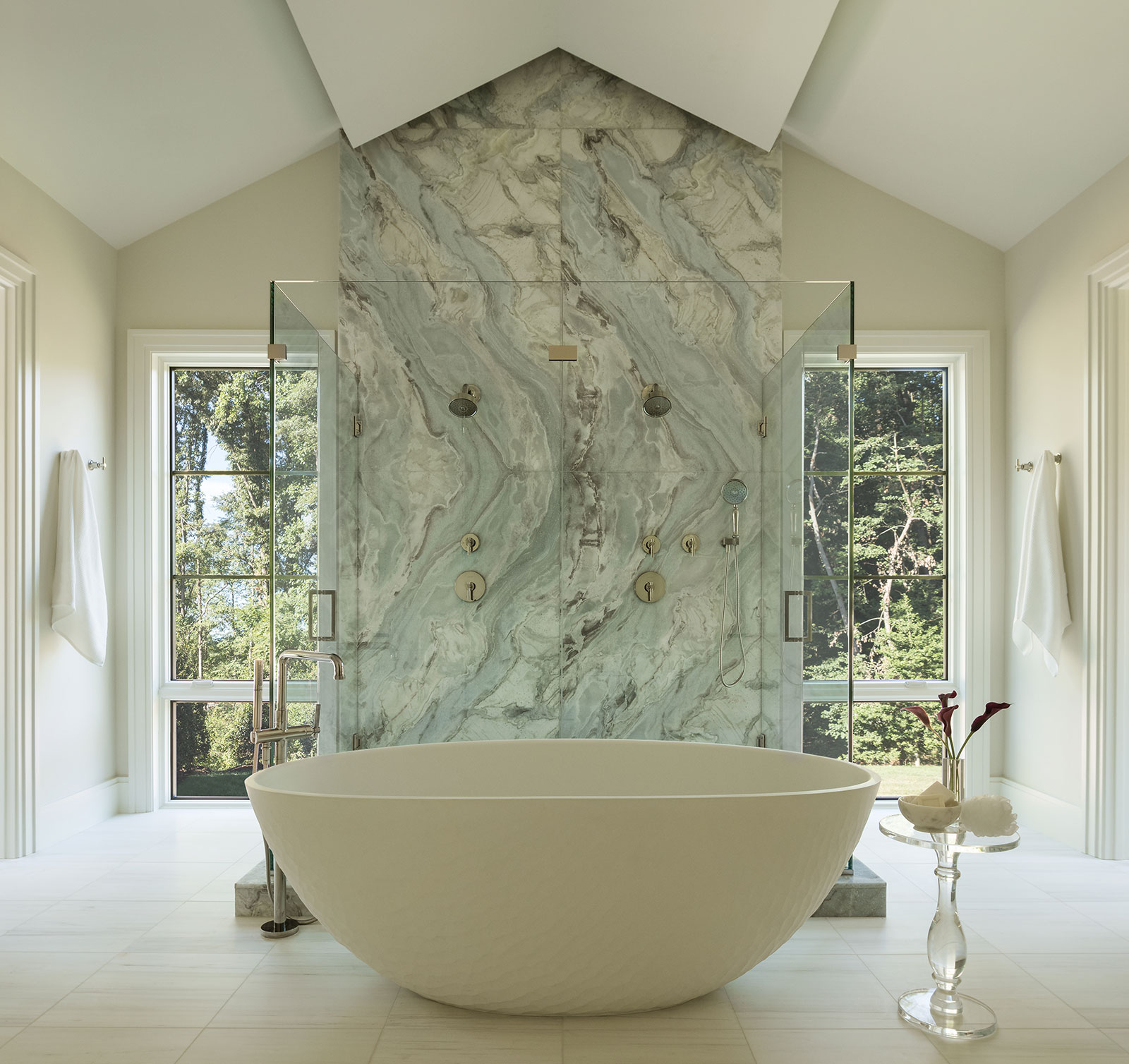 Picture windows flanking luxury bathroom
