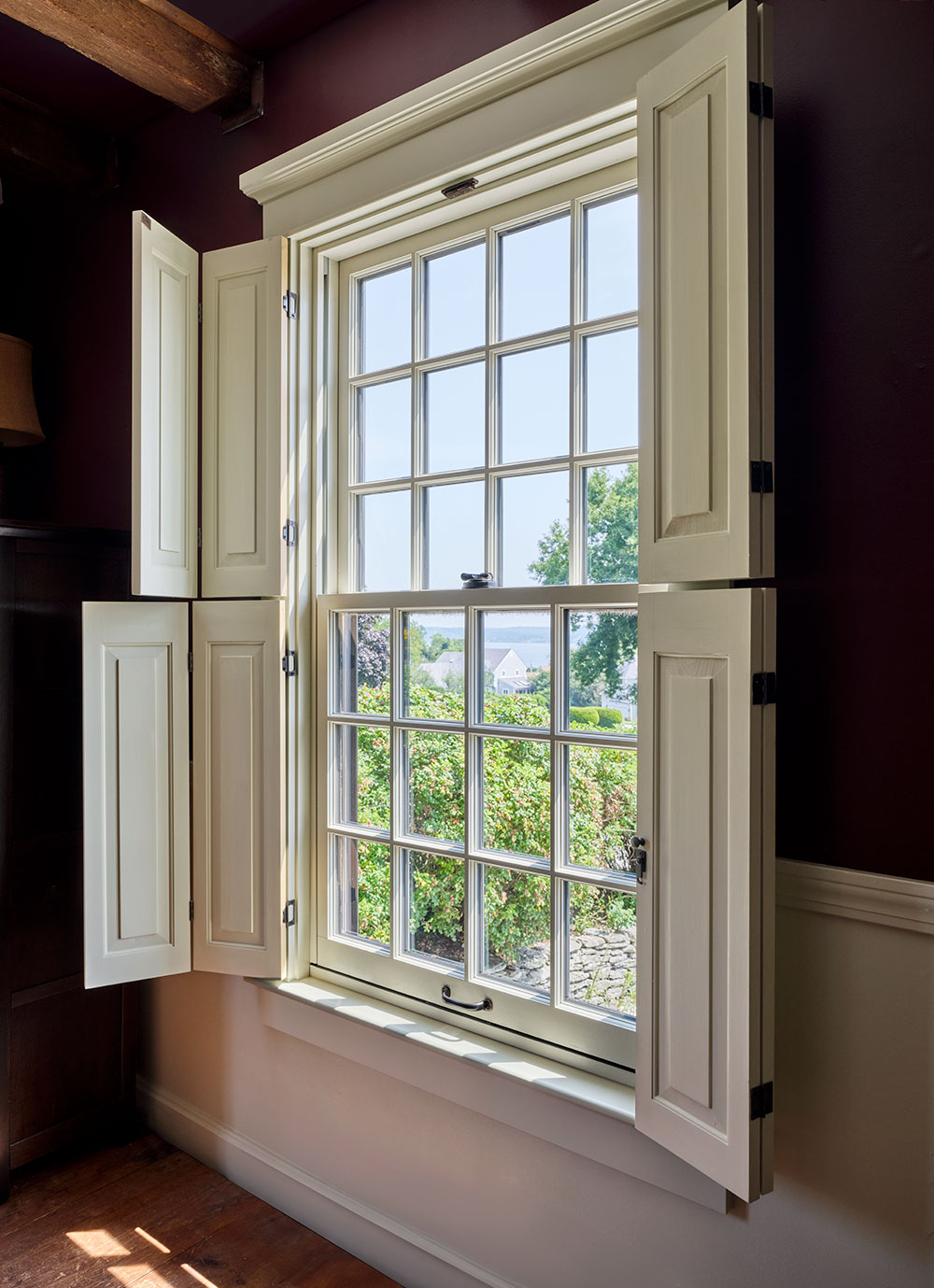 Traditional single-hung window with shutters