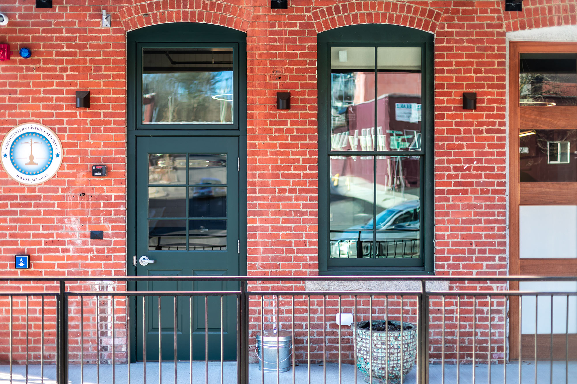 Single-hung windows on heritage brick building