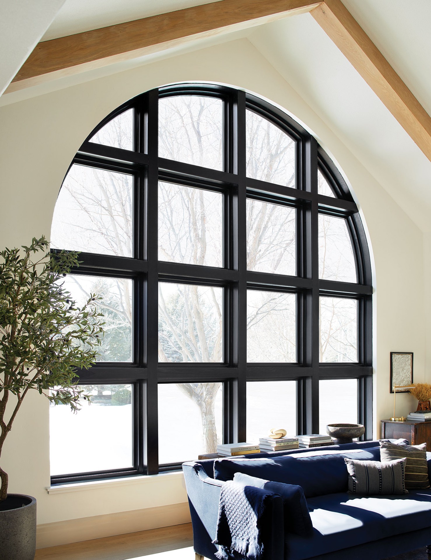 Large half-circle window with grilles in living room